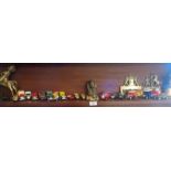 Collection of diecast cars and Tribal Art brass items