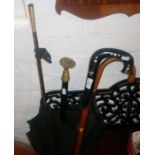 Carved walking stick, Victorian parasol and a fretwork music rack