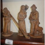 Three early 20th c Swiss (or ANRI) carved wood figures of peasants, one with alp horn