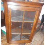 Glazed antique oak corner cabinet