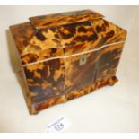 English Regency tortoiseshell double compartment tea caddy with pagoda top and standing on ball