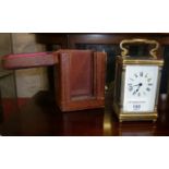 Victorian brass carriage clock, French movement, working order with key and leather case, 9" x 3"
