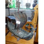 A bronze and copper model of a Viking longship with sail made by IronArt of Denmark