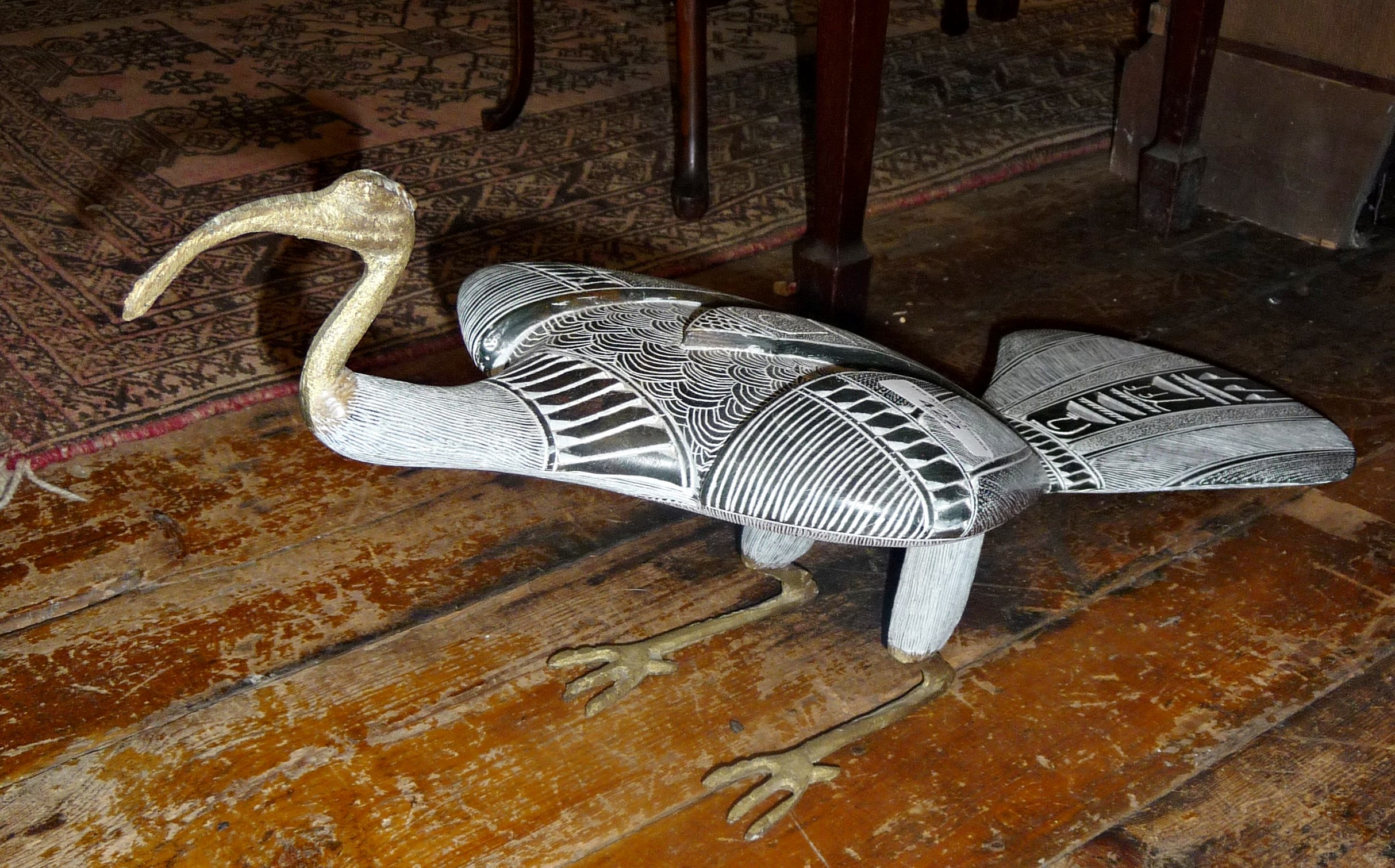 Egyptian carved stone and brass Ibis figure with hieroglyphics decoration, 22" long