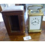 Victorian brass carriage clock, French movement, working order with key and leather case, 9" x 3"