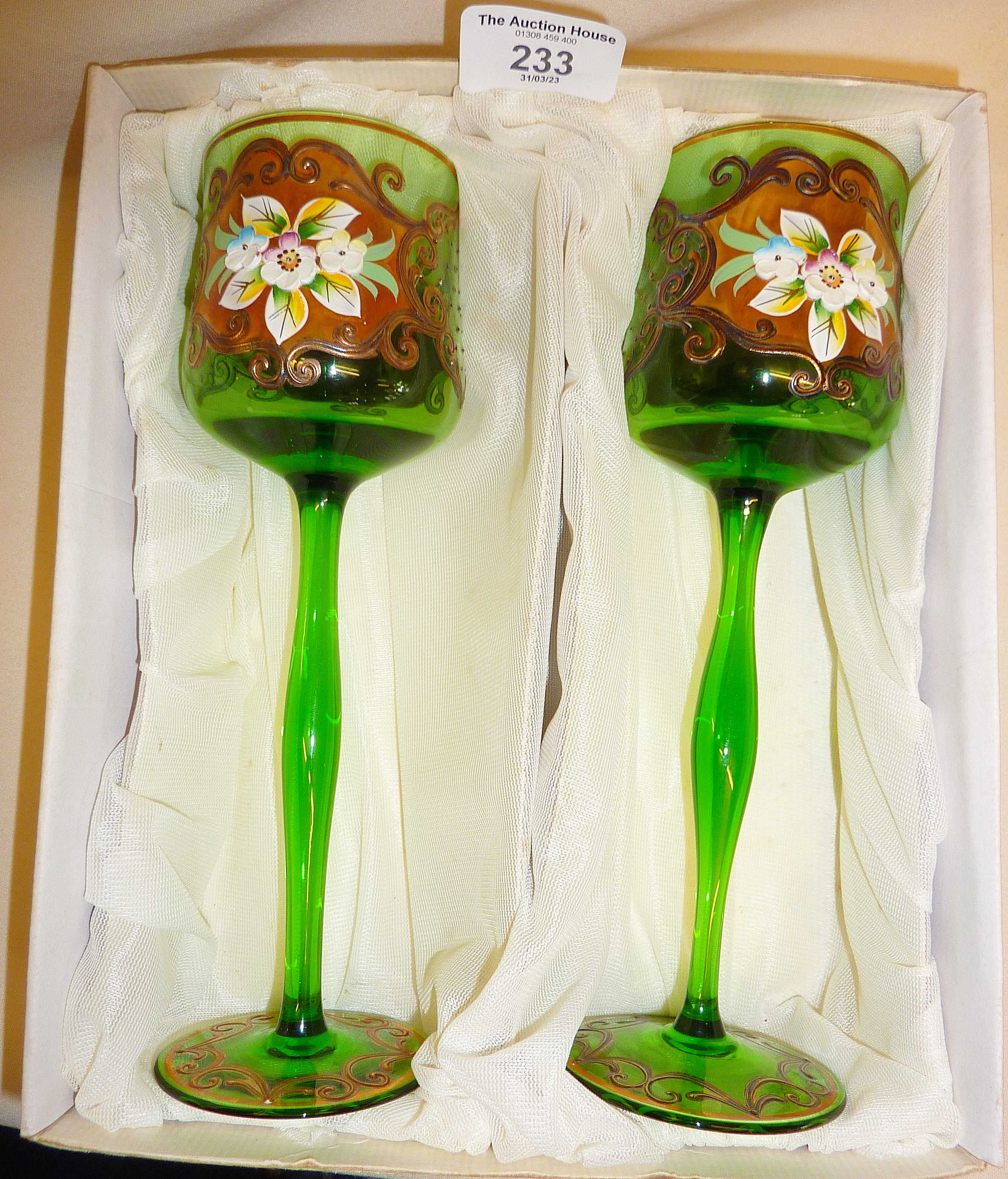 Pair of boxed tall green glasses enamelled with flowers, etc. Vendor purporting that these were