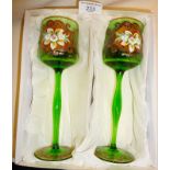 Pair of boxed tall green glasses enamelled with flowers, etc. Vendor purporting that these were