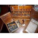 Victorian boxwood monoaural stethoscope, vintage test tube rack, opticians eyesight testing chart