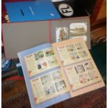 Three albums containing vintage postcards, and a scrap book