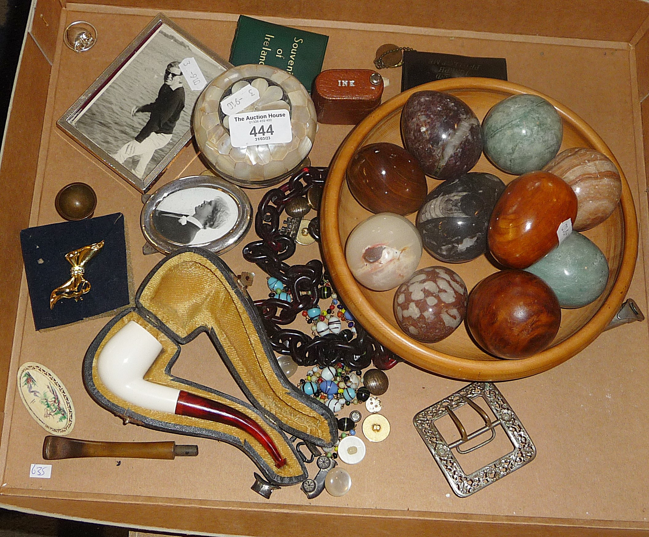 Assorted items, inc. marble eggs, a pipe in a case, etc.