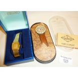 Vintage gold plated Seiko wrist watch in case together with a cased DeJuno watch