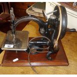 A Wilcox & Gibbs sewing machine, c. 1860 with wooden carrying case