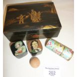 Oriental lacquered box, containing two finely painted Russian papier mache pill boxes etc.