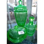 Three 1930s green glass vases with covers