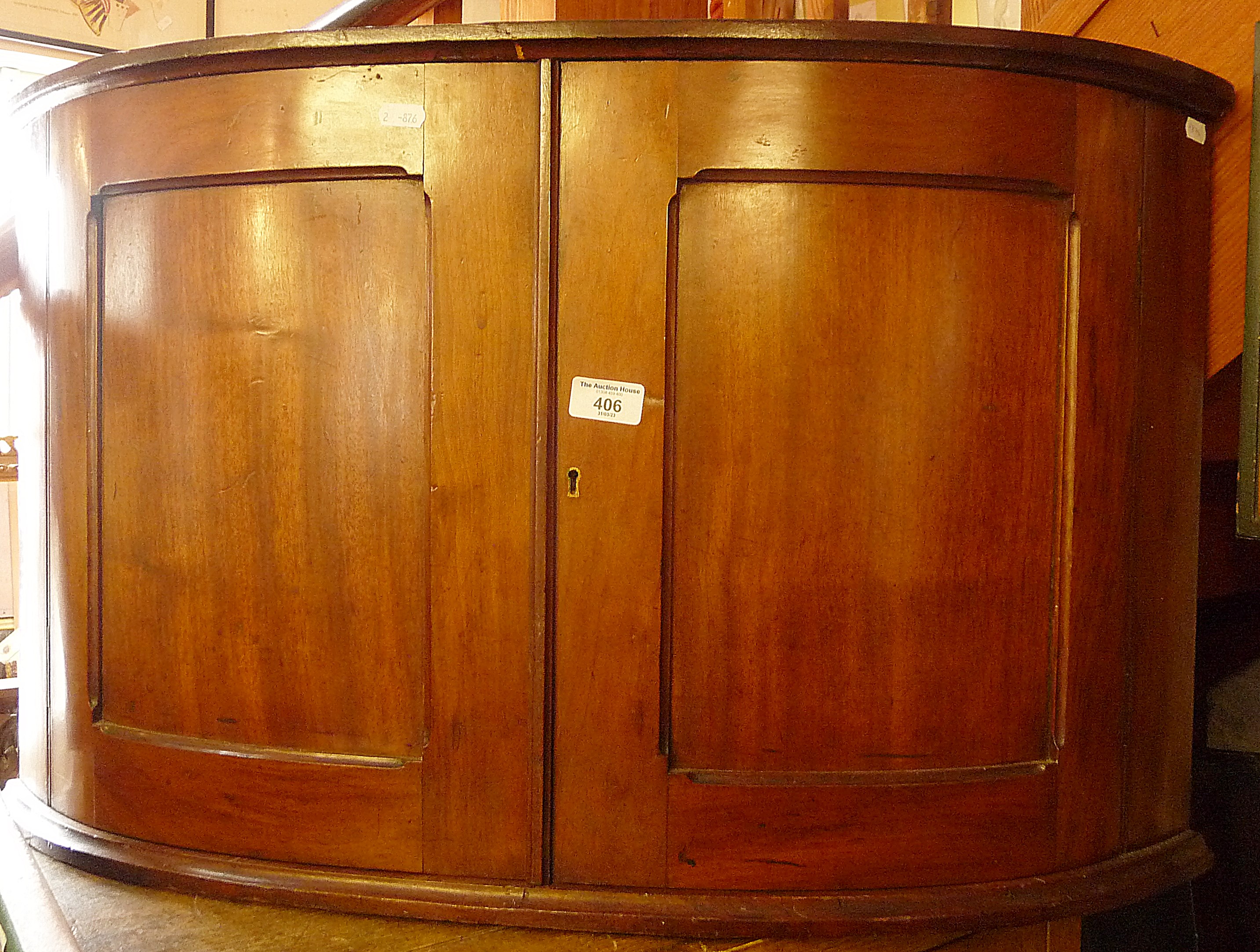 Mahogany bow-fronted wall hung corner cupboard