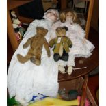 Two bisque headed dolls and two old teddy bears