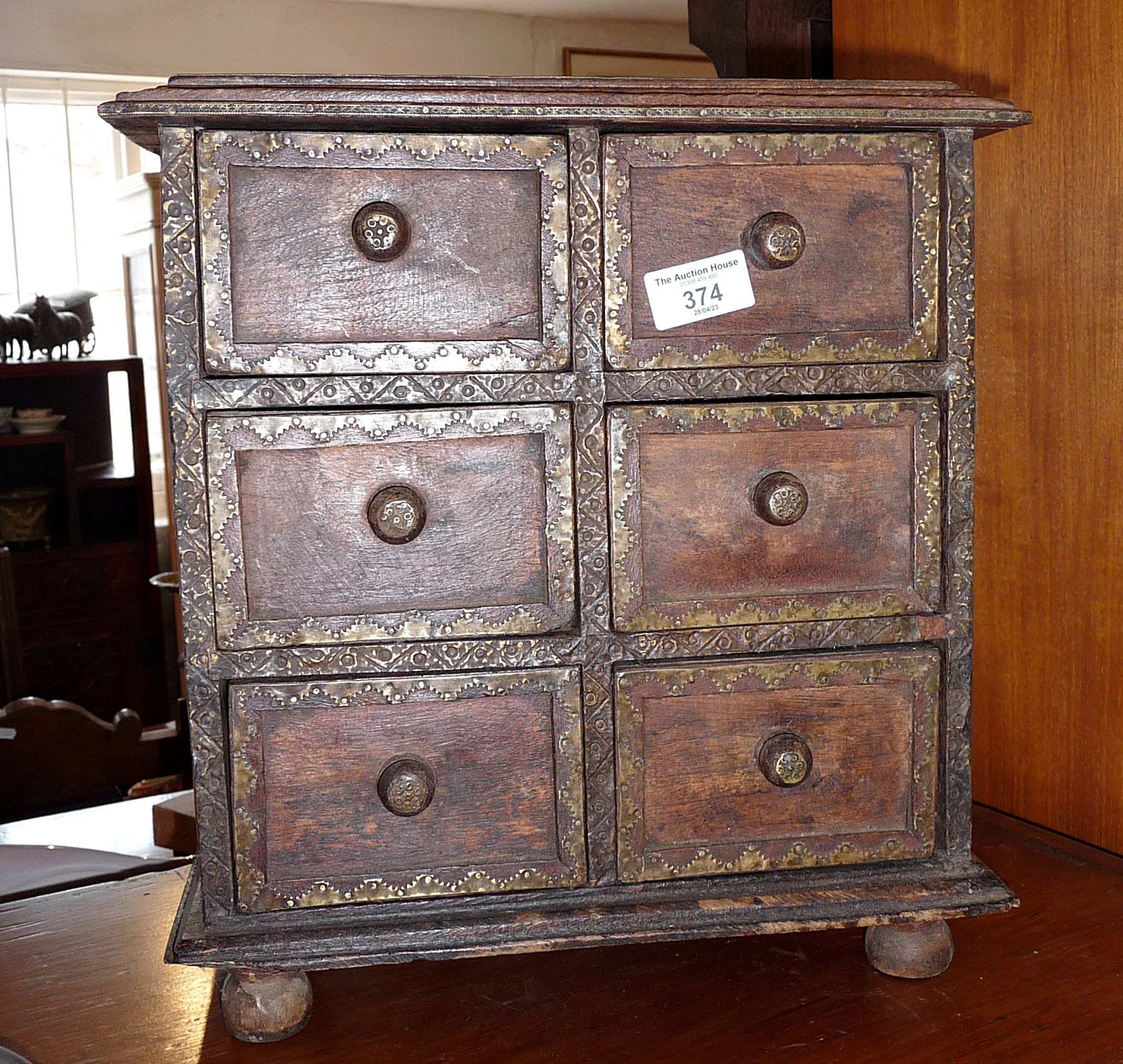 Chest of six spice drawers with decorative brass edging