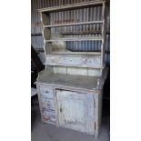 19th c. painted pine dresser having shelves and drawers above base with single cupboard door (one