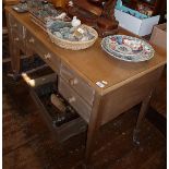 Edwardian limed beechwood kneehole writing desk having five drawers on square tapering legs