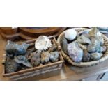 Two baskets of geodes, rocks and fossils