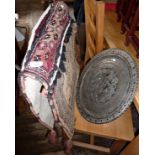 Turkish Kilim camel saddle bags, and an Ottoman silvered copper charger with chased figural