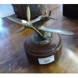 Brass model of WW2 Hurricane fighter plane mounted on turned mahogany plinth