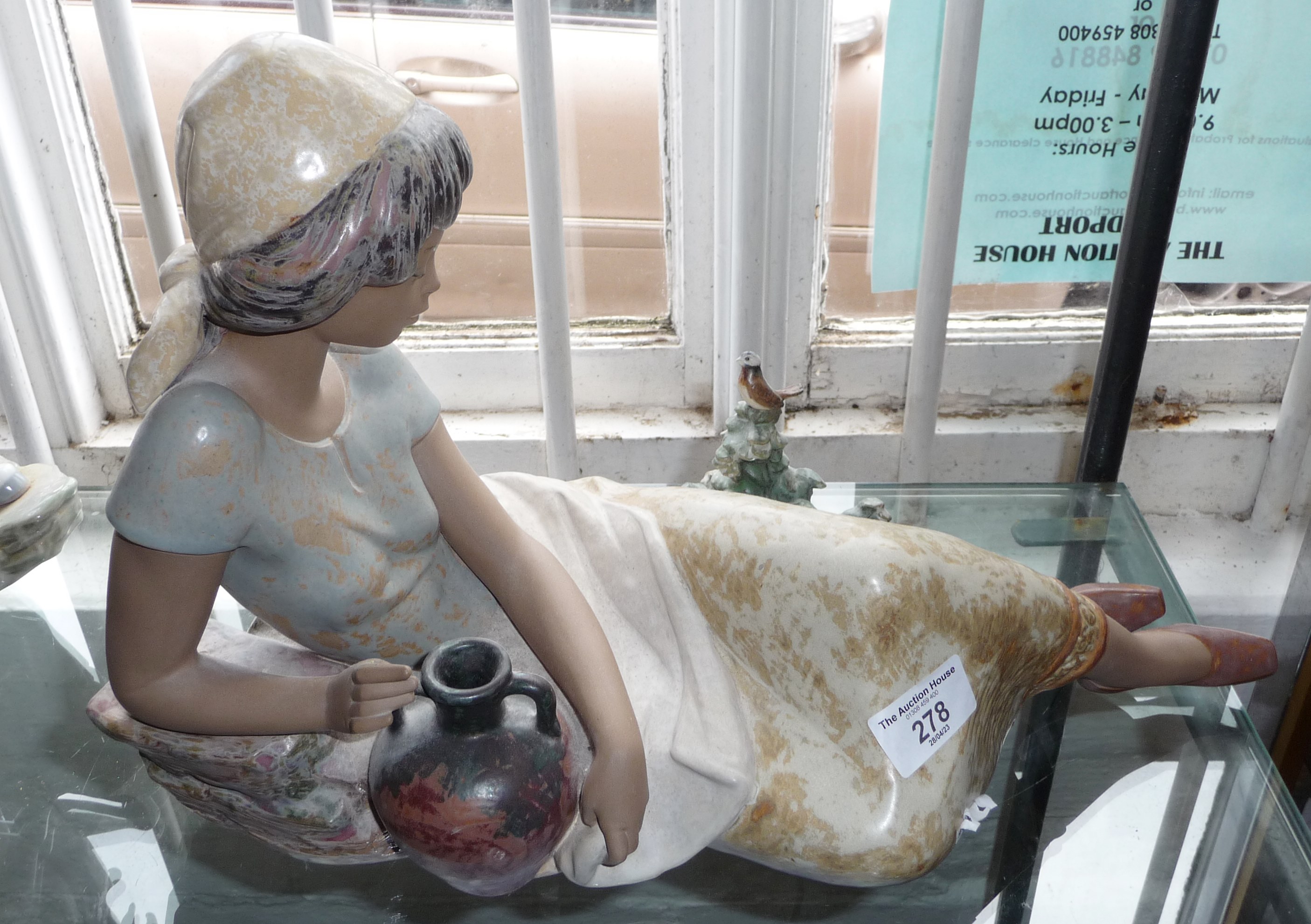Large Lladro figure of reclining pensive woman with water jug and bird, 42cm long, scarce