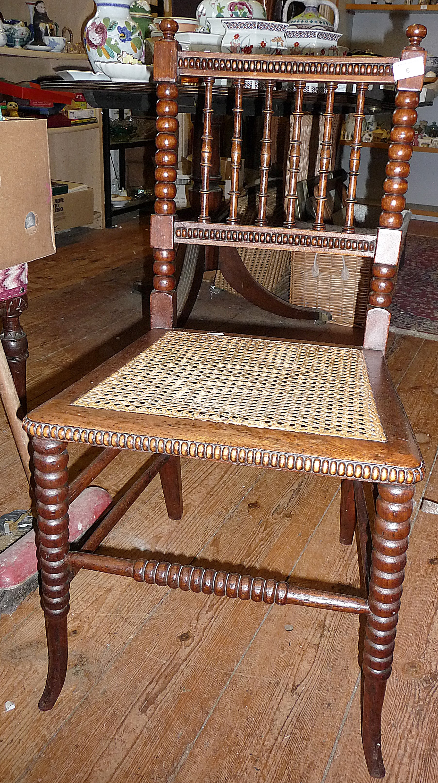 Victorian rosewood spindle back bedroom chair with bobbin turned uprights and legs having a cane
