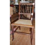 Victorian rosewood spindle back bedroom chair with bobbin turned uprights and legs having a cane