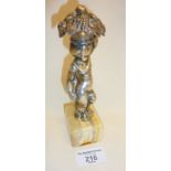 Silver plated figure of a putto holding a basket, on an onyx base
