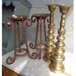 Pair of ironwork candlesticks and a pair of brass similar