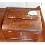 Victorian leather covered jewellery box having cantilevered sections interior and fall front