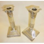 Pair of weighted columnar silver candlesticks. Hallmarked for London 1904 - Goldsmiths &