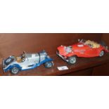 A Durango diecast model of a Mercedes 500k roadster and a Mercedes SSK