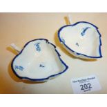 Pair of Georgian Caughley 'Locre Sprigs' blue and white leaf shaped butter dishes in the rare