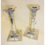 Pair of Mappin and Webb silver candlesticks in the Adams style. Hallmarked for London 1911 (with