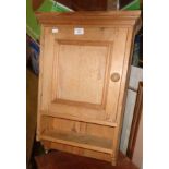 Stripped pine wall cupboard with shelf