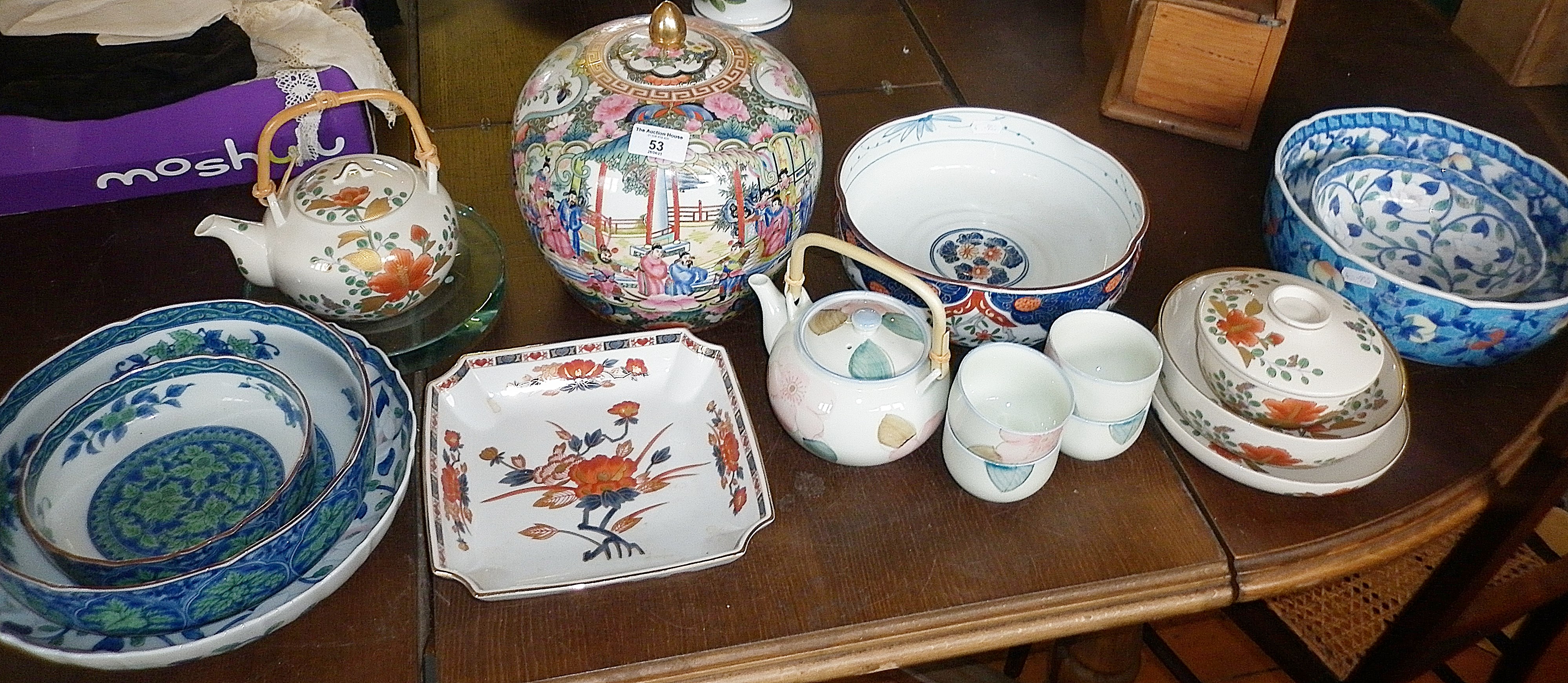 Collection of 20th c. Chinese and Japanese porcelain bowls, jars and teapots (17)