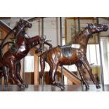 Pair of unusual varnished leather papier mache scale models of horses