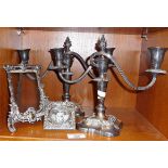 Pair of silver plated candlesticks and two photo frames, one antique and silver fronted