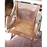 Carved oak Monk's chair with carved Latin lettering (later pegs)