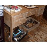 Edwardian limed beechwood kneehole writing desk having five drawers on square tapering legs