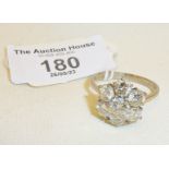 18ct white gold ring set with six diamonds in a cluster - central diamond 0.5 carat. UK size