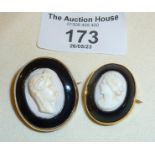 Two antique Etruscan revival carved shell cameo and onyx brooches (with pendant fittings). One