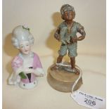 Spelter boot polisher boy figure on marble base, and a pincushion doll lady