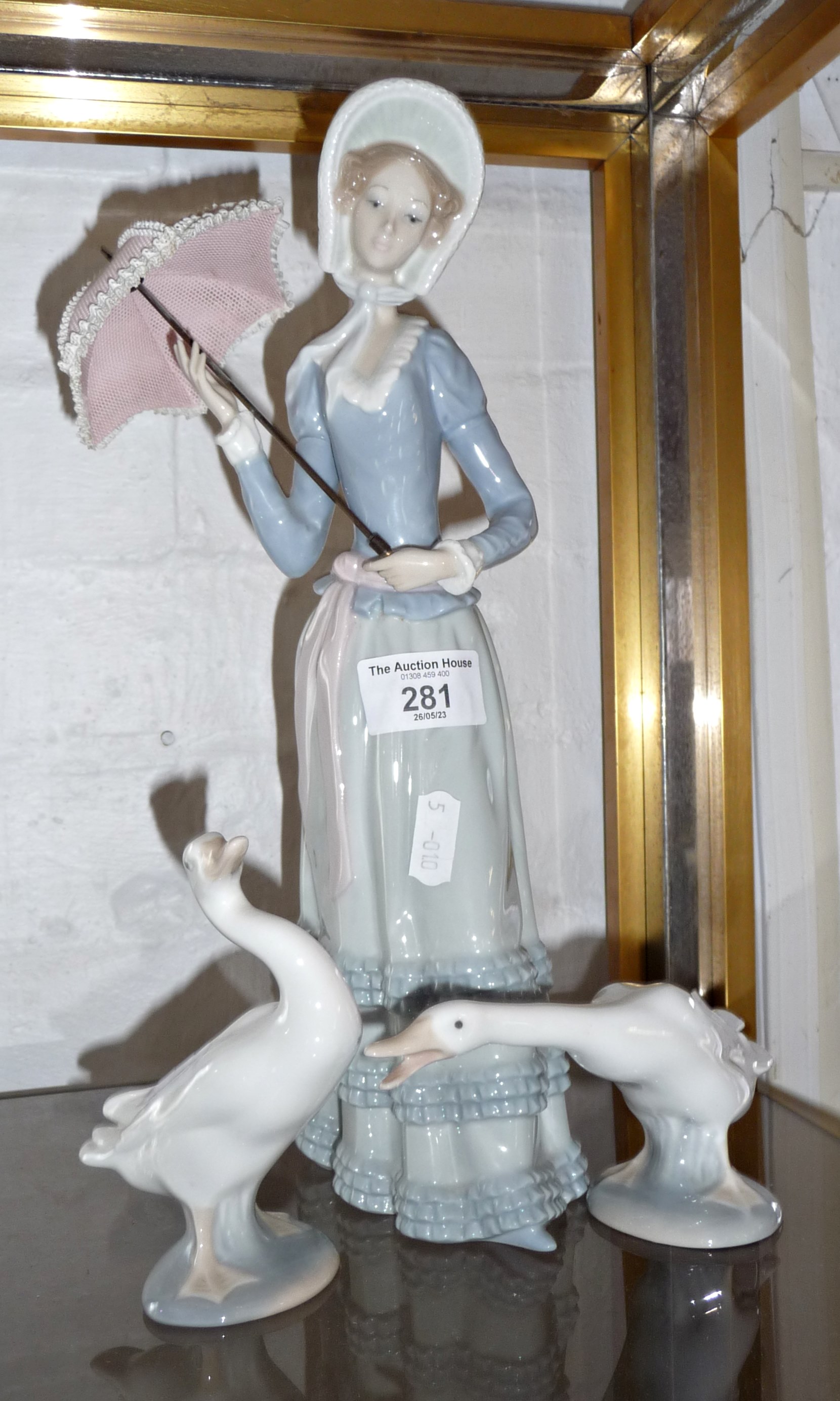 Lladro china figure of a lady with parasol and two geese