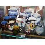 Collection of lustre ware jugs, blue and white jugs and four various Toby jugs (12)