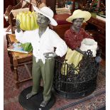 Pair of colourful painted fibreglass figures/plant holders of blackamoors in casual clothing and