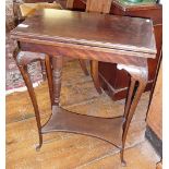 Small Victorian mahogany card table with swivel top above fine cabriole legs and shaped undertier