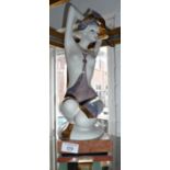 A Grupo Galas porcelain figurine of a semi clad kneeling woman, 47cm tall inc. marble plinth